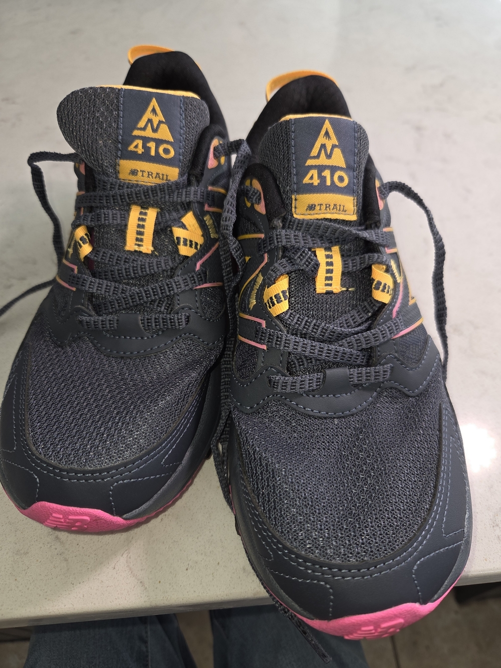 New Balance Trail Sneakers in Dark Gray with Pink and Yellow Accents